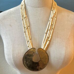 Brass cream beaded multi strand statement necklace